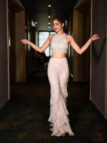 The playful movement of the tiered sharara pants makes this outfit perfect for dancing the night away at a sangeet. It’s a chic and comfortable alternative to a heavy lehenga.