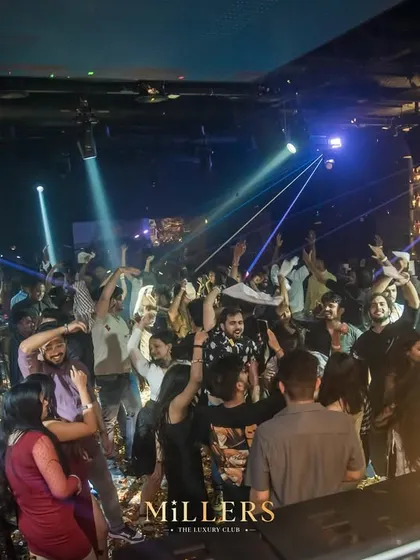 A wide shot of the dance floor at Millers Luxury Club, with lasers cutting through the air. This is the kind of full-production club experience I deliver.