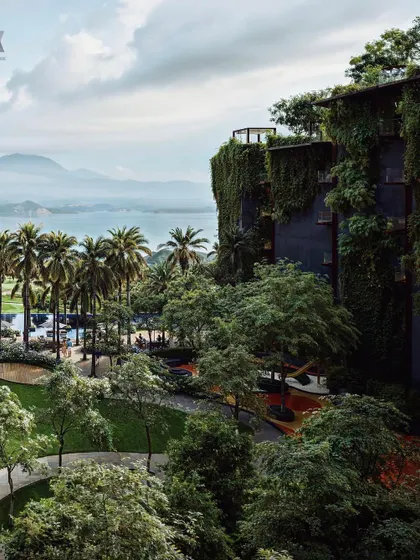 An aerial view of the Westin Nashik, showing how the hotel is nestled into the landscape. The terraced design and extensive green roofs help the building blend with its surroundings, minimizing its visual impact.