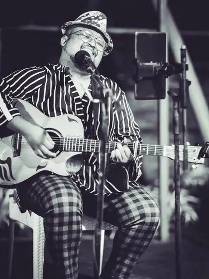A black and white portrait from a quiet, acoustic performance. It captures the introspective and heartfelt side of my music.