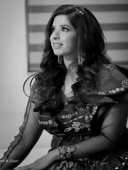 A beautiful black and white candid of the bride. Her natural smile and the soft lighting make this a timeless and elegant portrait.