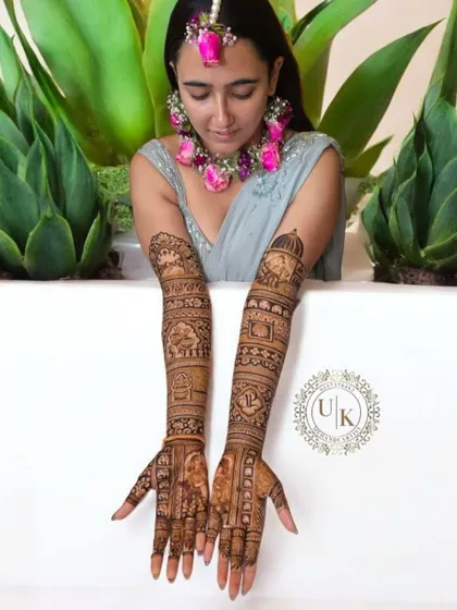 This bride looks so elegant with her full bridal mehandi. The design includes story-telling elements and traditional motifs, all done with organic henna for a beautiful, dark stain.