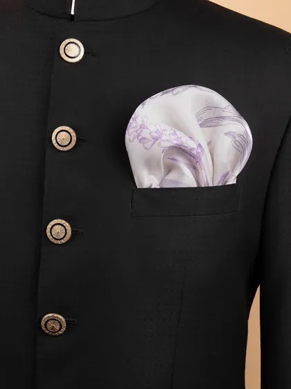The lavender floral pocket square folded into a jacket, showing its subtle and elegant appearance.