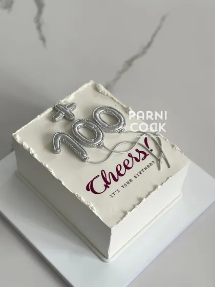 A celebratory cake for a 100th birthday! The silver balloon numbers make this a special and stylish way to mark an incredible milestone.