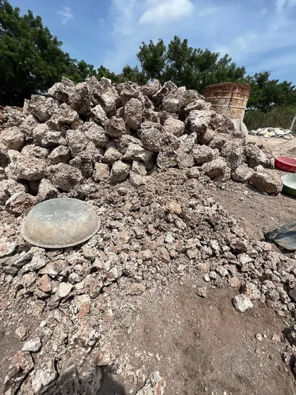 A pile of processed quicklime (calcium oxide) at the kiln site. This material will be carefully slaked with water to create the lime putty that forms the base of our strong, breathable, and long-lasting plasters and mortars.