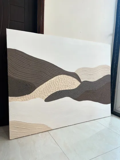 A 3ft x 4ft textured landscape painting. I used different textures to represent different parts of the landscape, from smooth hills to rough, patterned earth, all in a soothing, neutral color palette.