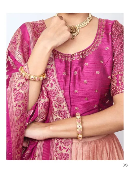 A close-up on the magenta silk blouse, showing the delicate embroidery and how it pairs with traditional jewelry.