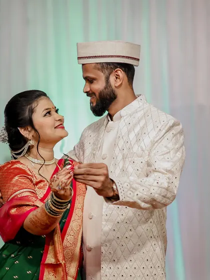 A candid, romantic moment from an engagement, with the couple sharing a dance.