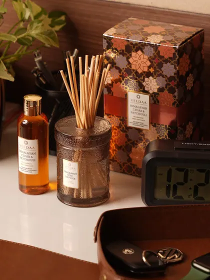 Our Himalayan Cedar & Patchouli reed diffuser, complete with its elegant packaging. This woody and earthy scent is ideal for creating a calm and grounded workspace. s personal space.