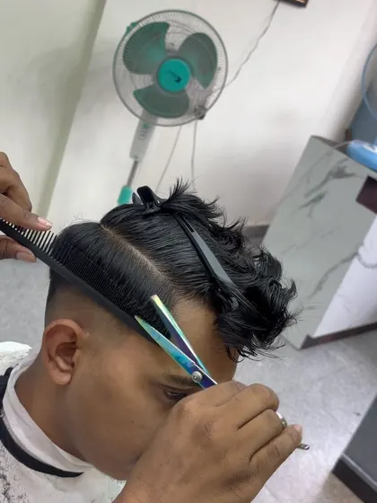 Another example of scissor-over-comb, a fundamental barbering skill.