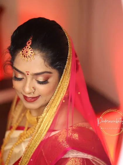 A close-up on the finished muhurtham makeup. The soft golden shimmer on the eyes and the elegant veil create a look that is both traditional and incredibly photogenic.