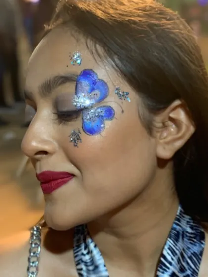 A stunning blue butterfly with silver glitter, looking almost 3D.