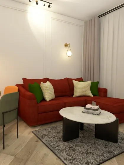 This L-shaped red sofa is a great choice for a small living room, providing ample seating without overwhelming the space. The neutral rug and walls provide a perfect balance.