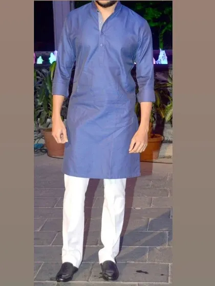 A simple blue kurta with a mandarin collar, tailored for a comfortable and neat fit. Perfect for casual wear or a small puja.