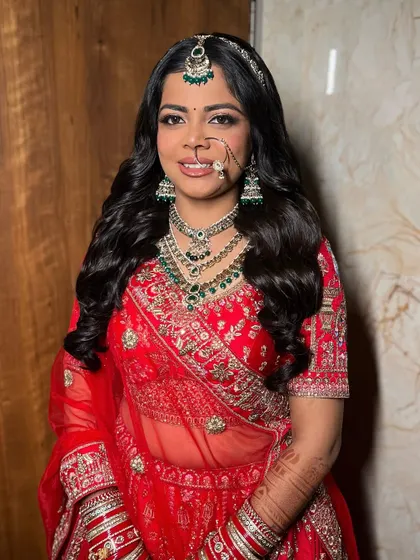 Lochan looking straight at the camera, confident and beautiful. Her flawless base and perfectly blended eye makeup were designed to last all day and look amazing in photos.