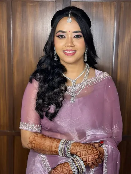 A beautiful reception look in a lovely lavender saree. I used soft pink and silver tones on the eyes to complement the colour of her outfit.