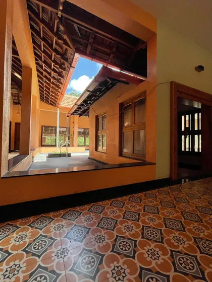 The transition from the covered veranda to the open courtyard, demonstrating how these traditional homes seamlessly blend indoor and outdoor living.