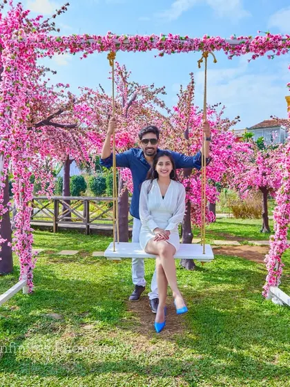 A fun and playful shot on our cherry blossom swing set, perfect for capturing the happy and carefree side of your relationship.