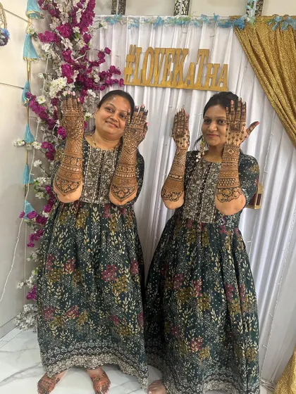 The mother and sister of the groom, both with stunning, full-coverage mehendi. We love dressing up the 'ladkewale'.