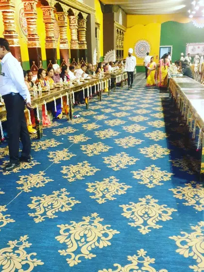 Guests enjoying a meal in our traditional seated dining hall. We manage large crowds efficiently, ensuring a comfortable and organized dining experience for everyone.
