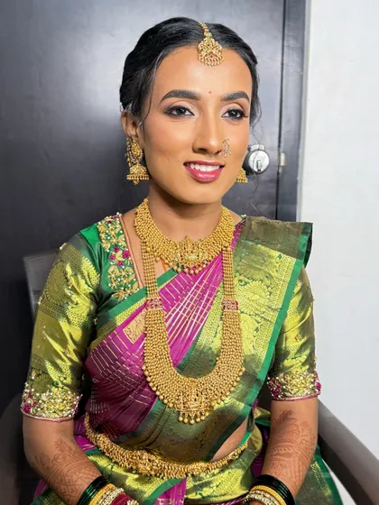 A smiling portrait of my dusky skin bride. The makeup is radiant and perfectly matched to her skin tone, enhancing her natural glow.