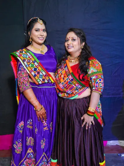 Two clients dressed in colorful traditional outfits for a Garba or Sangeet night. I created festive makeup looks for both of them.