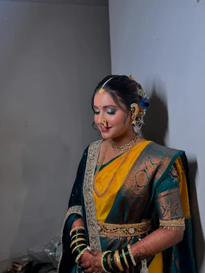 My beautiful Maharashtrian bride, looking serene and graceful in her Paithani saree and traditional jewellery.