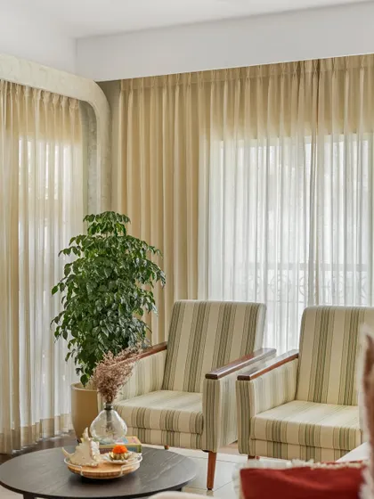 Another angle of the serene living area, showing how the placement of plants and furniture creates a breathable, comfortable environment.