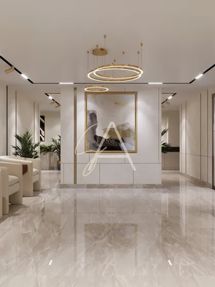 A long view down the main corridor, showing the consistent design language of neutral walls, gold accents, and contemporary art that ties the entire office space together.