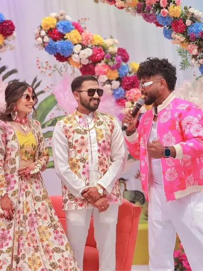 Interacting with the bride and groom during a colorful carnival. My job is to make them feel like the stars of the show.