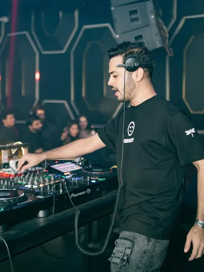 At the decks at Glitte Superclub, making sure every detail of the mix is perfect.