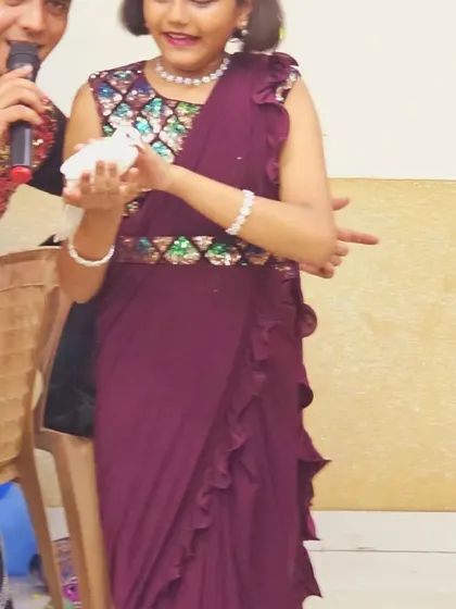 The birthday girl proudly holds the magic dove. These interactive moments make the birthday child feel extra special.