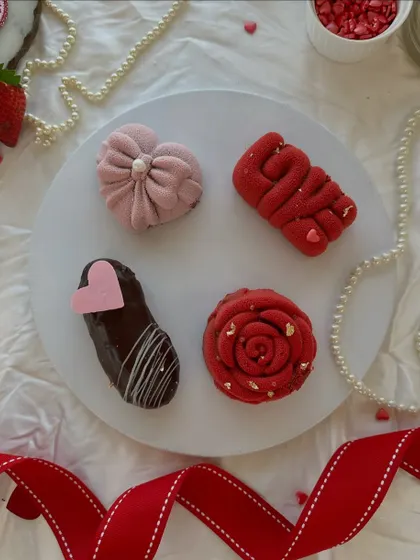 Decadent mini desserts crafted with love. These small, intricate cakes are perfect for a romantic Valentine's Day treat.