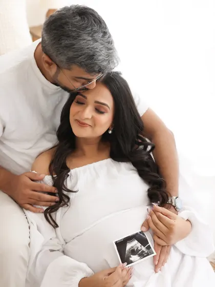 A picture of their future. Holding the sonogram photo together, this image is a beautiful and deeply personal celebration of the life they have created.