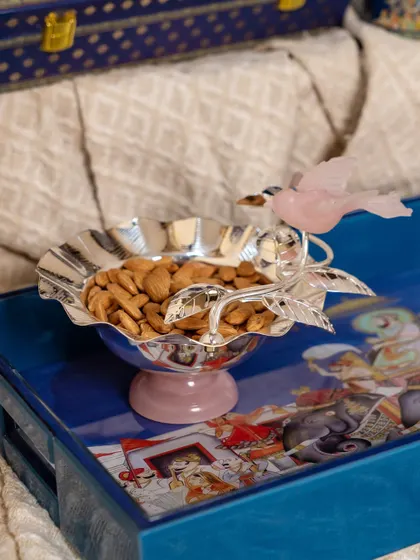 A serving bowl filled with almonds, placed on a tray from the Golden Dunes collection. This small detail illustrates how my designs extend to every aspect of the celebration, ensuring a cohesive and luxurious experience.