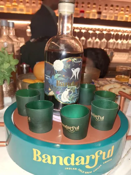 Showcasing Bandarful Indian Cold Brew Coffee Liqueur at the Juniper Club event. As a host for beverage brands, I ensure both the product and its unique serving rituals get the spotlight they deserve.