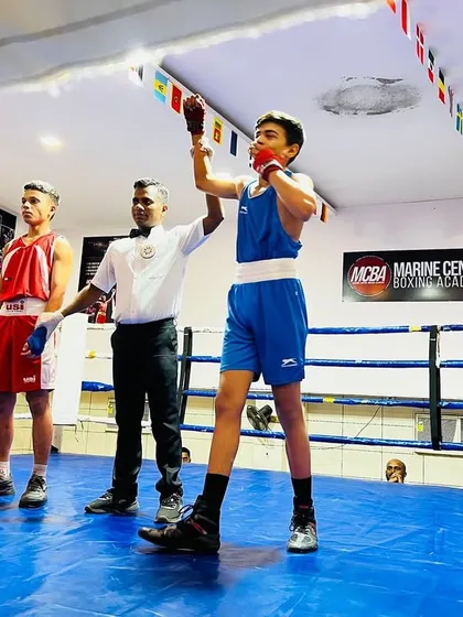 The moment of victory. The referee raises the arm of one of my students during the DSO Boxing tournament held at our academy. This is the culmination of months of hard work.