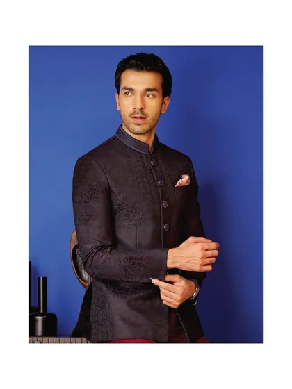 Style that fits like a dream, stitched just for you. This dark, subtly patterned bandhgala is a perfect example of our bespoke menswear, designed for reception style and modern elegance.