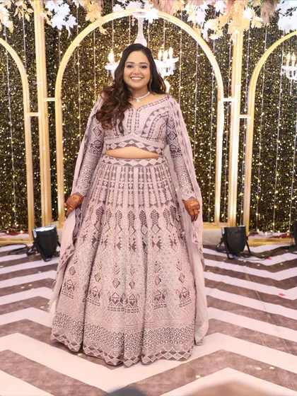Elegance meets shimmer for this Sangeet look. The makeup is all about glow, glam, and grace, creating a radiant look that's perfect for the dance floor.