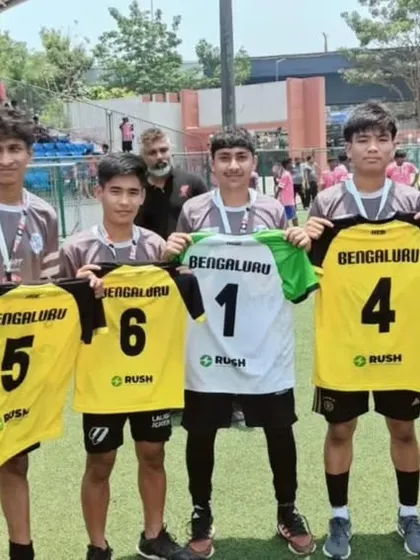 We are incredibly proud of the seven academy players who were scouted during the Bighit Sportz tournament. They are holding up their jerseys, a symbol of their hard-earned recognition.