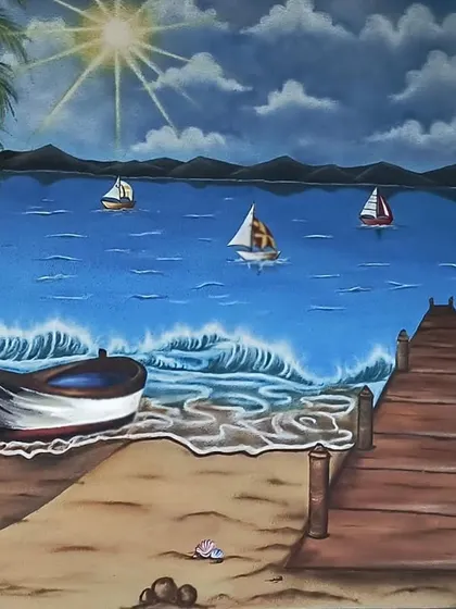 The full beach landscape painting, bringing a sense of peace and tranquility to the space.
