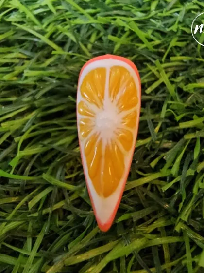 A collection of various nail art samples, from celestial and gold-leaf designs to embossed sweater patterns and fruit art, all showcasing the diverse skills our students learn at the academy.