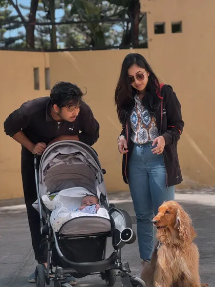 A candid moment from our New Year's photoshoot, with dad and baby sharing a look.