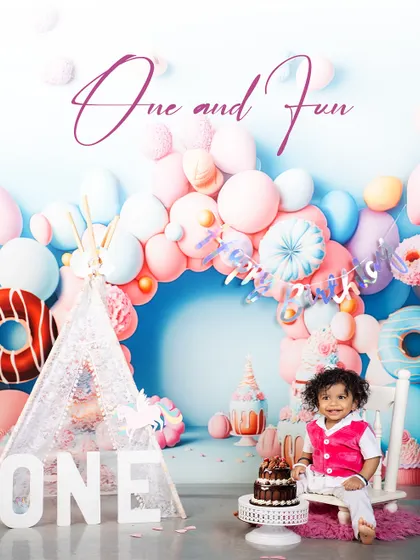 One and Fun! This little birthday boy is all smiles as he sits with his cake, ready to celebrate a year of incredible growth and joy. The theme is perfect for a fun-loving child.