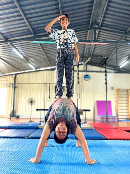 Fitness should bring you joy. Our partner acrobatics classes are filled with laughter and support, proving that building strength and balance is more fun with a friend.