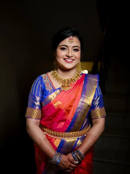 This bride is absolutely glowing in her vibrant pink and blue Kanchipuram saree. I created a soft, luminous makeup look with a defined eye to ensure she looked and felt her best for her engagement photos.