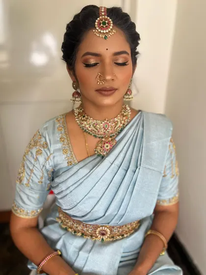A close-up showing the soft, blended eyeshadow and the clean, defined eyeliner. This style of makeup enhances the client's features without feeling too heavy.
