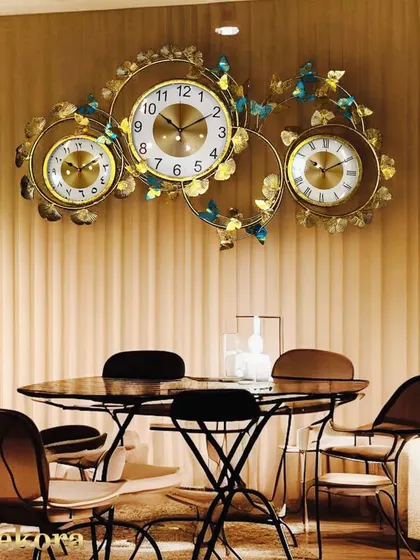 For the globally connected, this unique wall clock displays three different time zones. It's an intricate, large-scale piece perfect for an office or a grand living area.