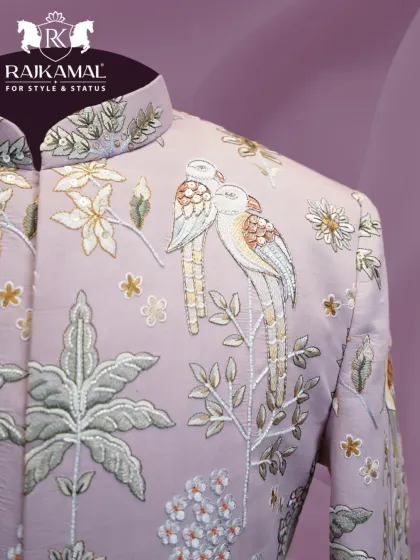 A close-up of the lovebird motif embroidered on the lilac Jodhpuri, a detail that tells a story.