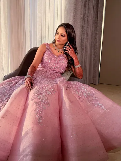 A full-length shot showing the grandeur of the lilac ball gown for the reception.